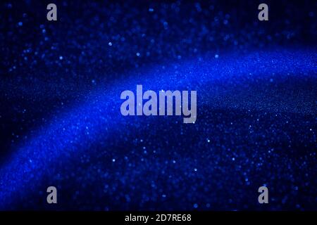 Majestic dark blue sparkle snow. Cosmic Christmas background for design, cards, posters. Stock Photo