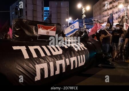 JERUSALEM, ISRAEL - OCTOBER 24: A submarine mock-up ( In reference to the so-called submarine affair a massive alleged procurement bribery scandal ) lies on the road during a mass demonstration near prime minister's official residence on October 24, 2020 in Jerusalem, Israel. Protest organizers said in a statement that 170,000 people showed up to demonstrate against Prime Minister Benjamin across the country demanding his resignation due to his indictment on graft charges and handling of the COVID-19 pandemic. Stock Photo