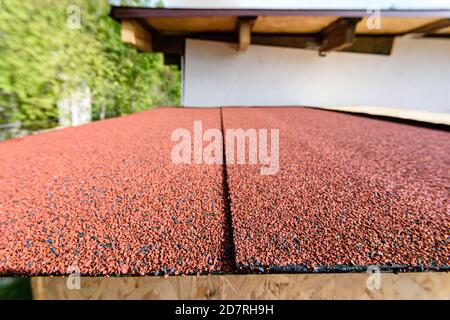 For the roof, a red roll flexible bituminous tile was used Stock Photo