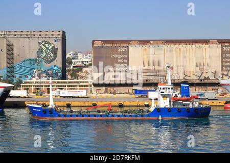 Archon Michail, an oil products tanker, departs the port of Piraeus, Greece.  The vessel was built in 1985 and sails under the Greek flag. Stock Photo