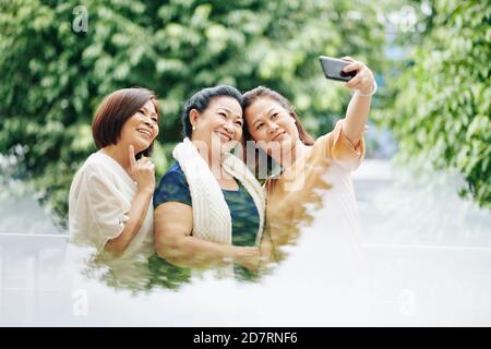 Senior friends taking selfie Stock Photo