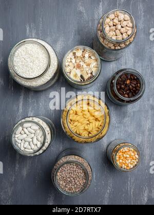 Set of glass jars with various ingredients placed on a table. Zero waste concept. Top view Stock Photo