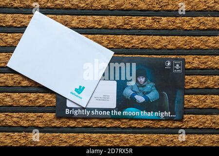 Post mail on doormat - Christmas appeal from the Salvation Army - brightly shone the moon that night Stock Photo