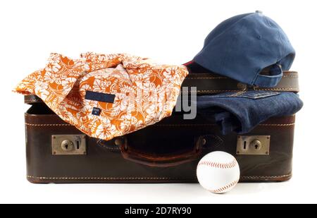 Isolated old vintage Suitcase with Baseball and Clothes on white Background Stock Photo
