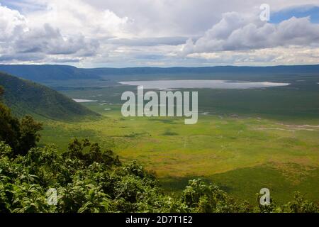 Ngorongoro Conservation Area, is a protected area and a World Heritage Site located 180 km (110 mi) west of Arusha in the Crater Highlands area of Tan Stock Photo