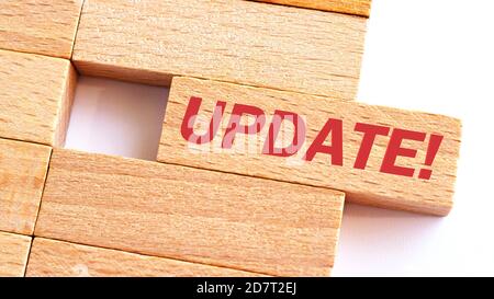 UPDATE word written on wood block. UPDATE text on table, concept.Business photo text make something more modern or up to date like software program Stock Photo