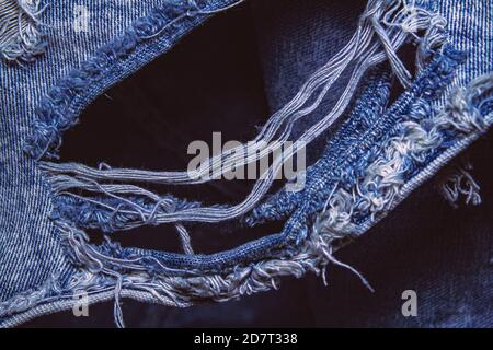Close-up popular trend ripped jeans or distressed jeans Stock Photo