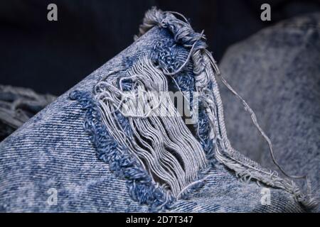 Close-up popular trend ripped jeans or distressed jeans Stock Photo