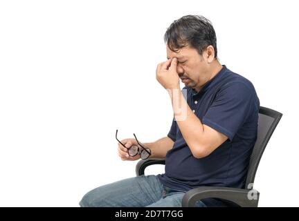 Middle-aged man sitting on chair and feeling stressed and headache isolated on white background. Problem and health care concept. Stock Photo