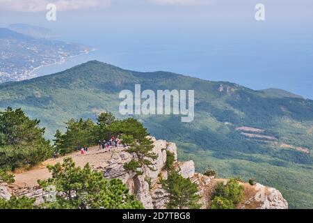 Beautiful landscape. Crimean mountains. Tourists on the observation deck of the Ai Petri plateau. Stock Photo