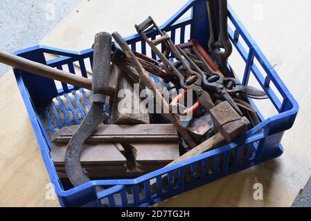 Toolbox or Box of Old Tools including Old Woodworking Tools or Carpentry Tools, Old Scythe & Old Rusty Secateurs Stock Photo