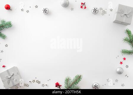 Christmas composition. Christmas decor, gift boxes, pine cones on white background. Top view, copy space. Stock Photo