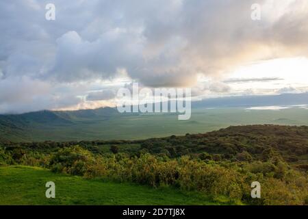 Ngorongoro Conservation Area, is a protected area and a World Heritage Site located 180 km (110 mi) west of Arusha in the Crater Highlands area of Tan Stock Photo