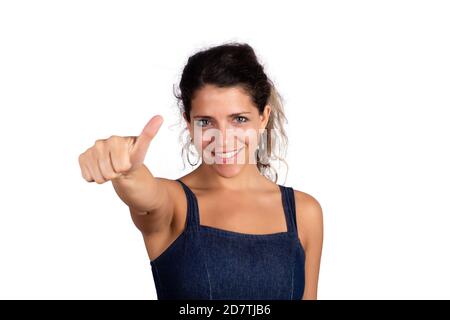 Portrait of young beautiful woman with thumbs up on studio. Isolated white background. Stock Photo