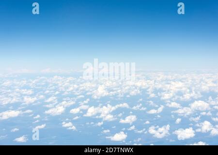 Light rare cumulus good weather clouds on a summer day, panorama view from a height Stock Photo