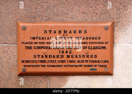 Glasgow Standard Measures on wall of city chambers. An usual feature on the buidling. Sign read standard of Imperial Lineear Measure, Place on the wall and a joining footpath by Gcorporation of City of Glasgow 1882