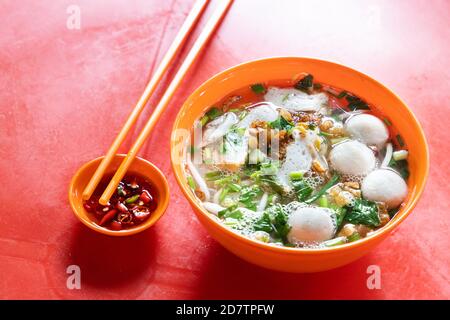 Simple Chinese fish ball noodle soup served in bowl Stock Photo