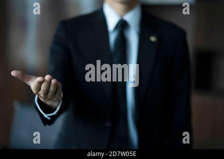 Cropped image of lawyer welcoming hand Stock Photo