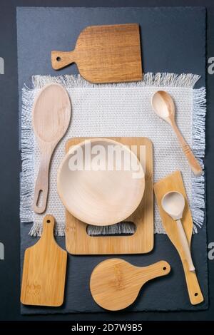 wooden kitchen appliances spoons, cutting boards. the view from the top. vertical photo Stock Photo