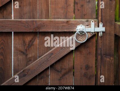 Ring handled gate latch in close up on a gate Stock Photo