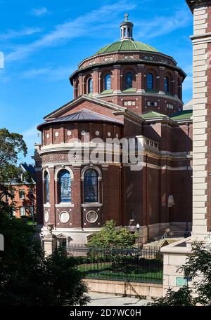 The exterior of Columbia University's St. Pauls Chapel (1907), looking toward the apse. It clad in red brick and limestone. Stock Photo