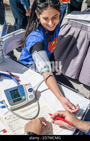 Miami Florida,Mayor's Health & Fitness Challenge,free blood pressure check checking taking measuring,Hispanic woman, Stock Photo