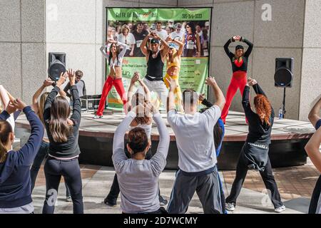 Miami Florida,Mayor's Health & Fitness Challenge,Zumba salsa aerobics session class workout,Hispanic woman female women man men male, Stock Photo