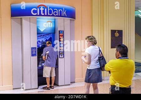 Miami Beach Florida,Convention Center,customers line queue Citibank ATM,bank banking making withdraw withdrawing money men male female women man woman Stock Photo