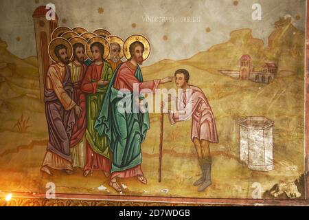 The Christian Orthodox church in Tifesti, Vrancea County, Romania. Fresco depicting Jesus Christ healing the blind man. Stock Photo