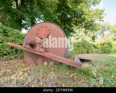 Steel old grass roller on grass yard. Playground maintenance Stock Photo