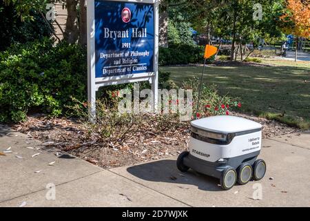 Starship Delivery Robot roams the campus of the University of Mississippi delivering food with Starship Technologies autonomous delivery service. Stock Photo