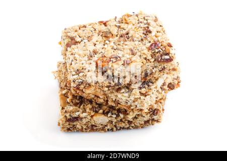 Homemade granola from oat flakes, dates, dried apricots, raisins, nuts isolated on white background. Side view, close up, macro. Stock Photo