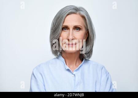 Confident mature business woman isolated on white background, headshot portrait. Stock Photo