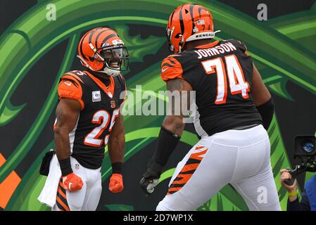 Cincinnati, OH, USA. 25th Oct, 2020. Tyler Boyd #83 of the Cincinnati  Bengals runs the ball after a catch as Ronnie Harrison #33 of the Cleveland  Browns attempts a tackle during NFL