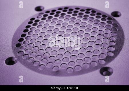 Close-up, shallow focus of a meshed style cooling panel used on a main frame computer. The circular holes aid active venting of hot air within the com Stock Photo