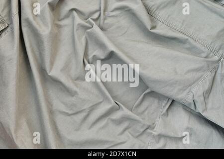 The texture of the fabric is olive-colored, which is similar to the uniform of American soldiers of the Second World War. Background image for militar Stock Photo