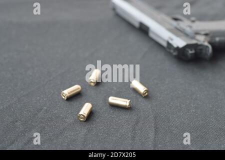 9mm Bullets And Pistol Lie On A Black Fabric A Set Shooting Range Items Or A Self Defense Kit Golden Shells Near Handgun Stock Photo Alamy