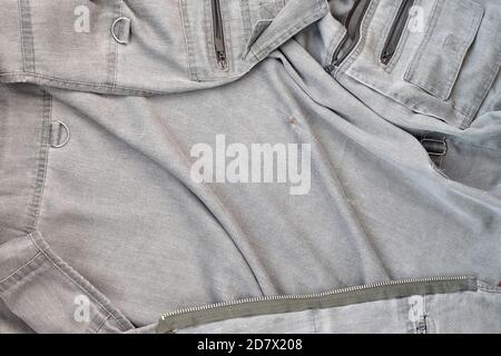 The texture of the fabric is olive-colored, which is similar to the fisherman or hunters waistcoat. Background image for fishing and hunting design. Stock Photo
