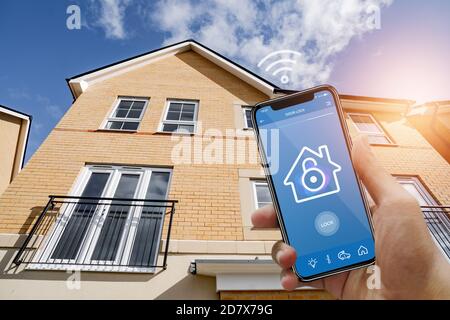 Smart home with smart app mobile control device security app to unlock the door concept. Stock Photo