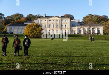 London, Britain. 25th Oct, 2020. People walk in front of Kenwood House in north London, Britain, on Oct. 25, 2020. Another 19,790 people in Britain have tested positive for COVID-19, bringing the total number of coronavirus cases in the country to 873,800, according to official figures released Sunday. The coronavirus-related deaths in Britain rose by 151 to 44,896, the data showed. Credit: Han Yan/Xinhua/Alamy Live News Stock Photo