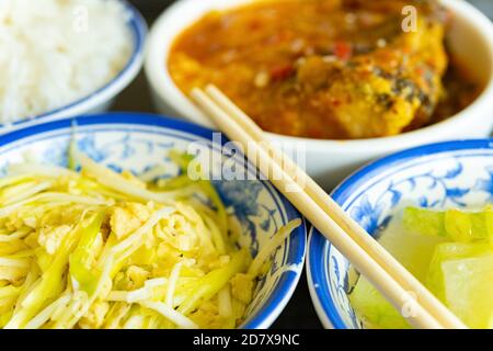 side view scrambled eggs with hotbed chives and deep fried fish and fuzzy melon with rice Stock Photo