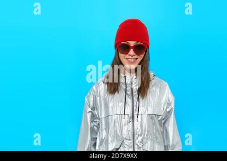 Happy woman in warm clothes and sunglasses Stock Photo