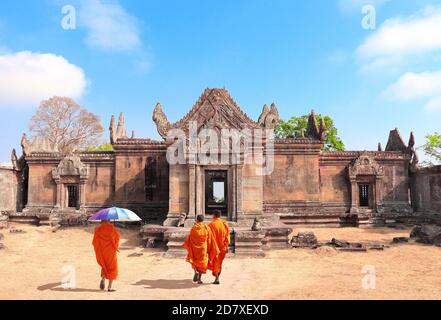 Three buddhist monks go to Gopura I in Preah Vihear Temple complex (Prasat Phra Wihan), Cambodia. UNESCO world heritage site Stock Photo