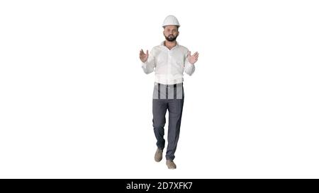 Engineer in hardhat walking and explaining something on white ba Stock Photo