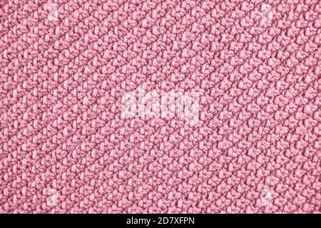 Knitted texture in pink color. Close up. Stock Photo