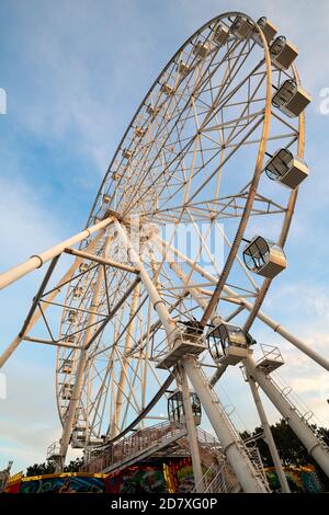 Ferris wheel against the blue sky at sunset Stock Photo
