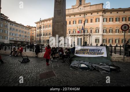 Rome, Italy. 25th Oct, 2020. Continuous garrison in front of the Palazzo di Montecitorio, organized by the family members of the 18 Italian fishermen detained in Libya. Fishermen kidnapped in Libya, for weeks the relatives in protest in front of Piazza Montecitorio, seat of the Chamber of Deputies. (Photo by Andrea Ronchini/Pacific Press) Credit: Pacific Press Media Production Corp./Alamy Live News Stock Photo