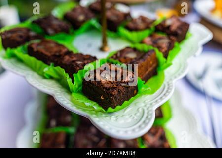 small cakes with different stuffing on party or wedding table. Selective focus. Stock Photo