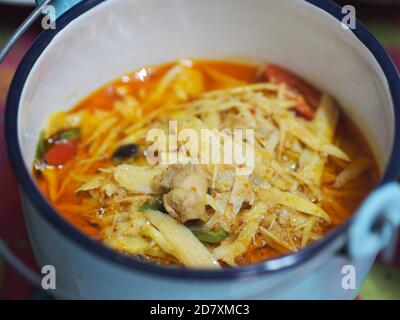 Red Curry with Chicken and Bamboo Shoots in white bowl, Thai food Stock Photo