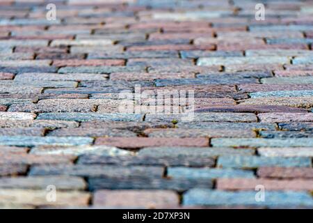 stone pavement texture, granite cobblestoned pavement background, abstract background of old cobblestone pavement close-up Stock Photo